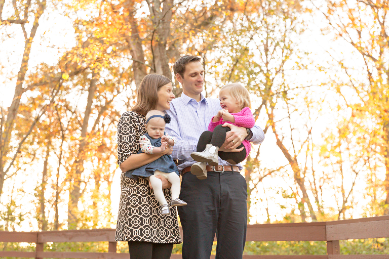 Mom & Dad with two girls in park | St. Louis Family Photographers