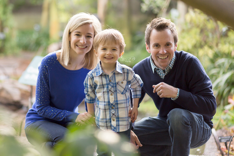 Family with young son kneeling and smiling - St. Louis Photos