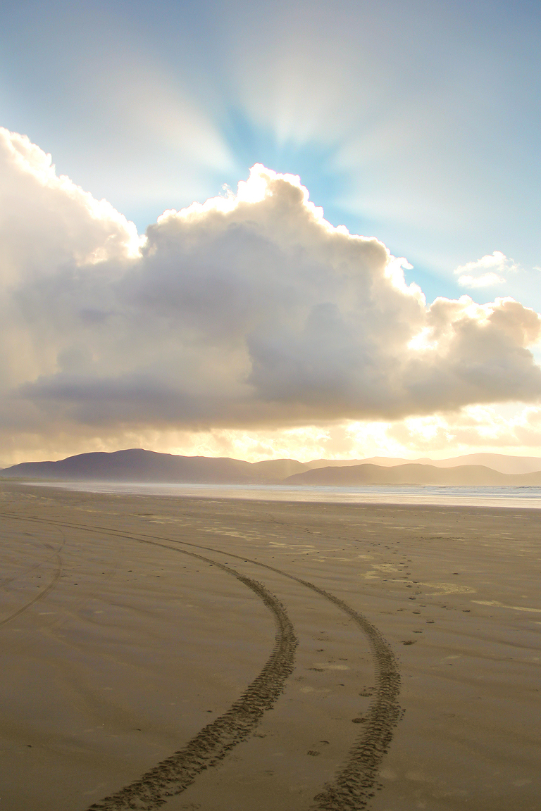 Sunburst and tire tracks Inch Beach Ireland | St. Louis Photographer