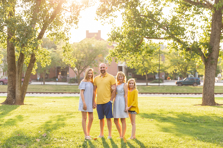 Family of 4 in St. Charles park at sunset.