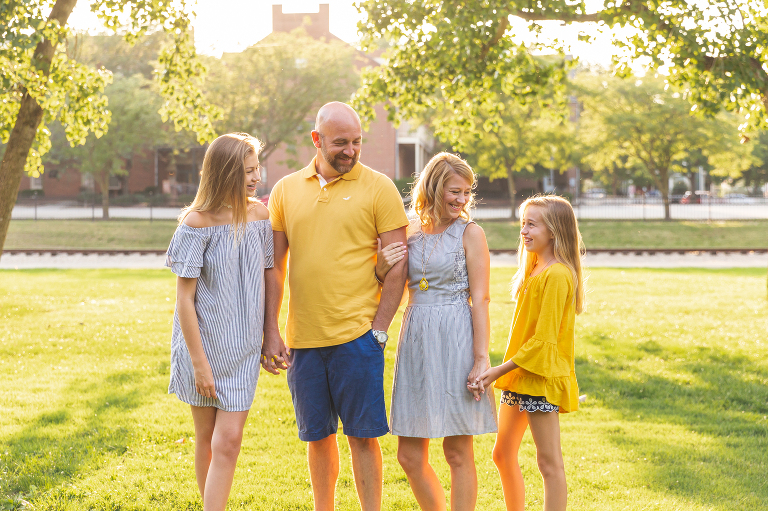 Mom and Dad with their daughters having fun.