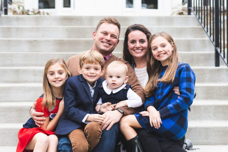 Mom, Dad, and kiddos smiling for camera at Oak Knoll Park | St. Louis Family Photography