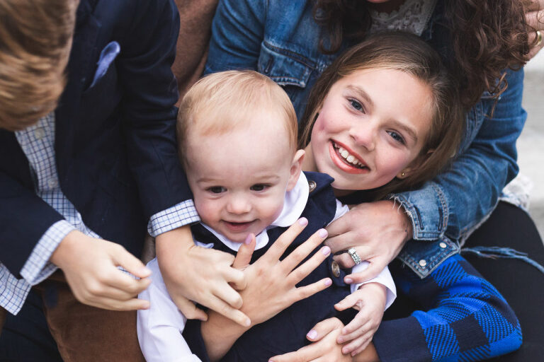 Big sister loving on baby brother at Oak Knoll Park | St. Louis Family Photographer